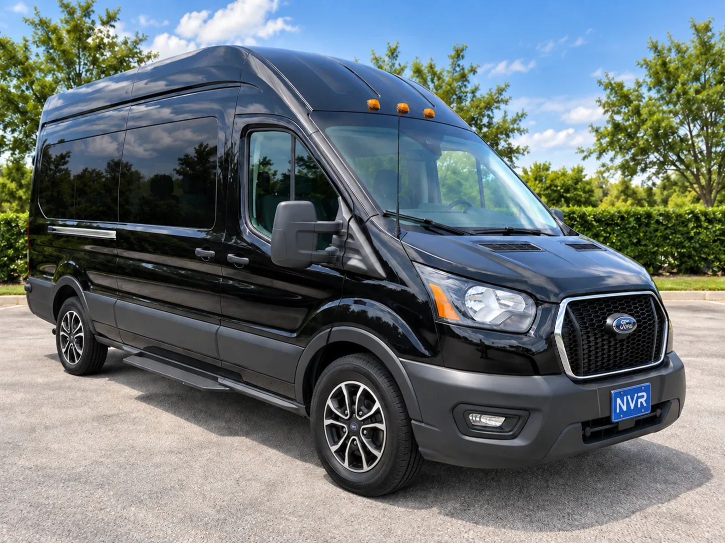 Rendering of a black high roof 12 or 15 passenger van