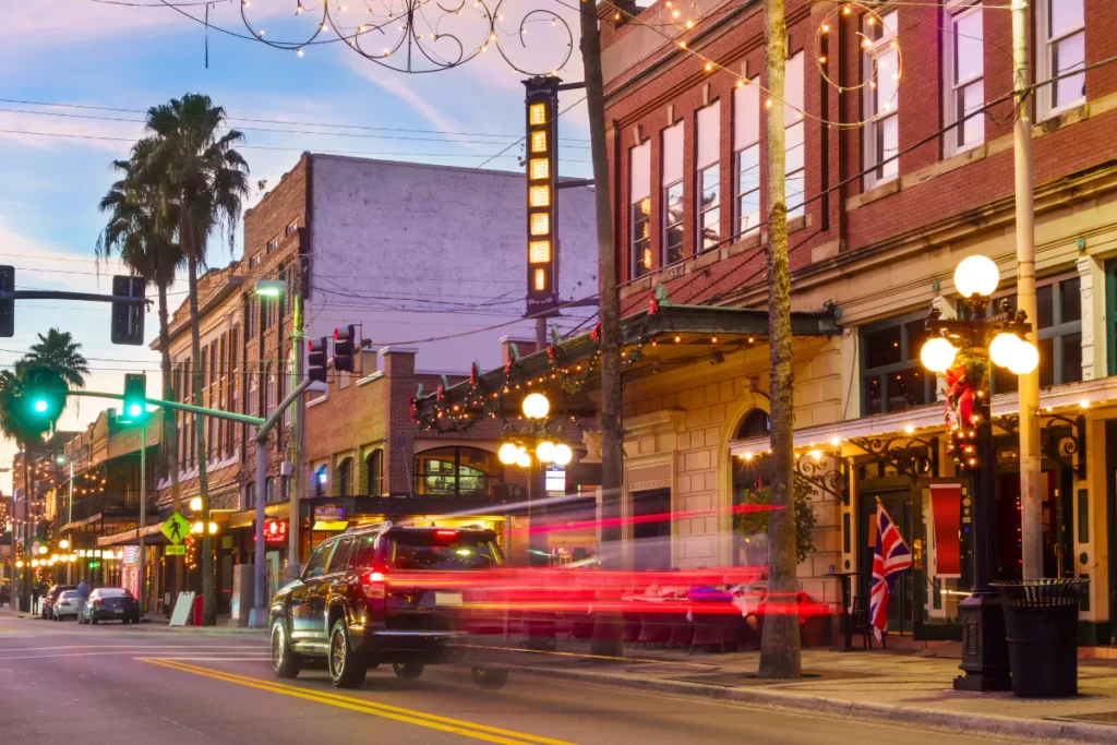 Busy street at dusk with lights and cars